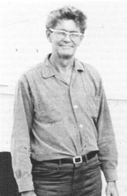 A person wearing glasses and a button up shirt</p>
<p>Description automatically generated